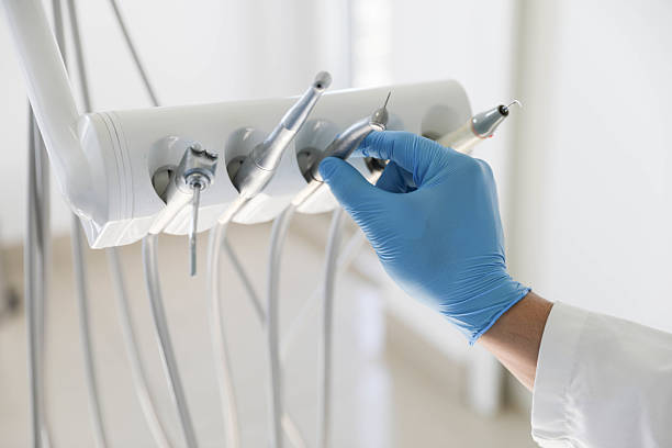 Professional Tooth Extraction technician working in Henderson County County, NC